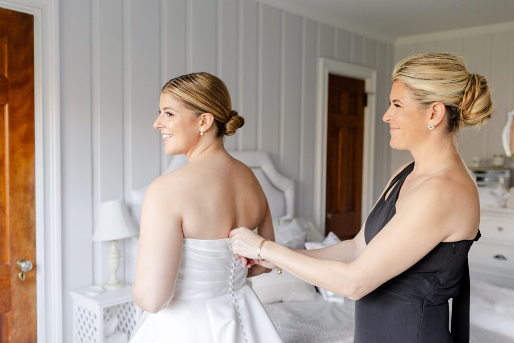 bride getting ready, bride and sister getting ready, classic wedding dress