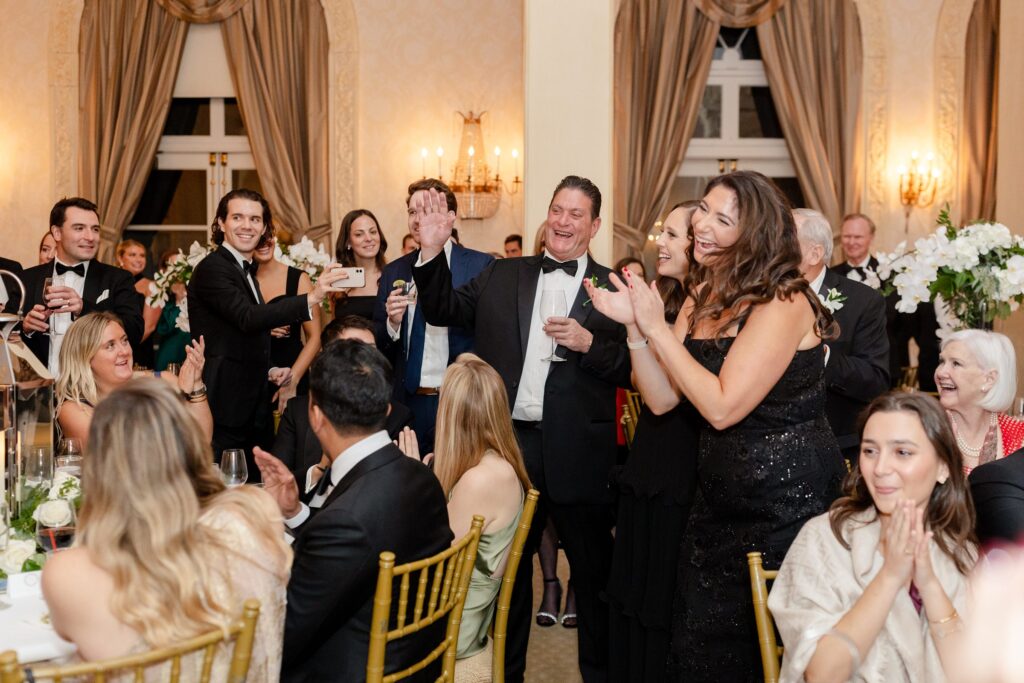 Wedding speeches, guests laughing at wedding toasts