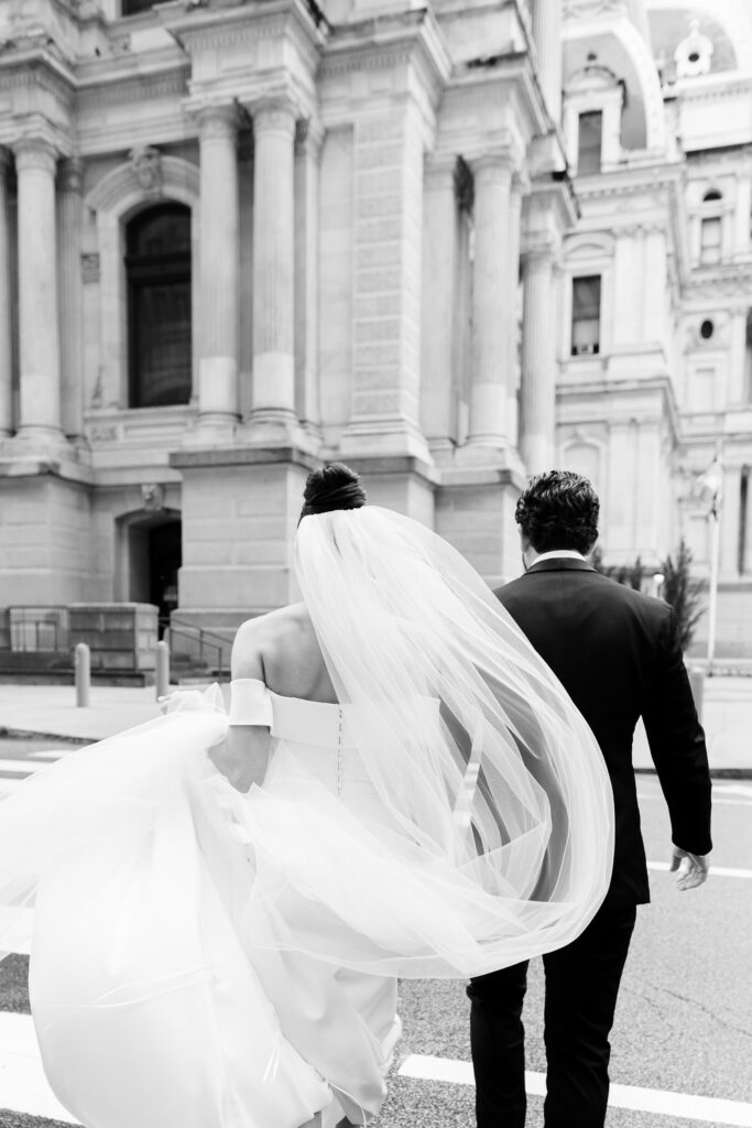 bride and groom portraits, bride and groom walking downtown Philadelphia, wedding veil