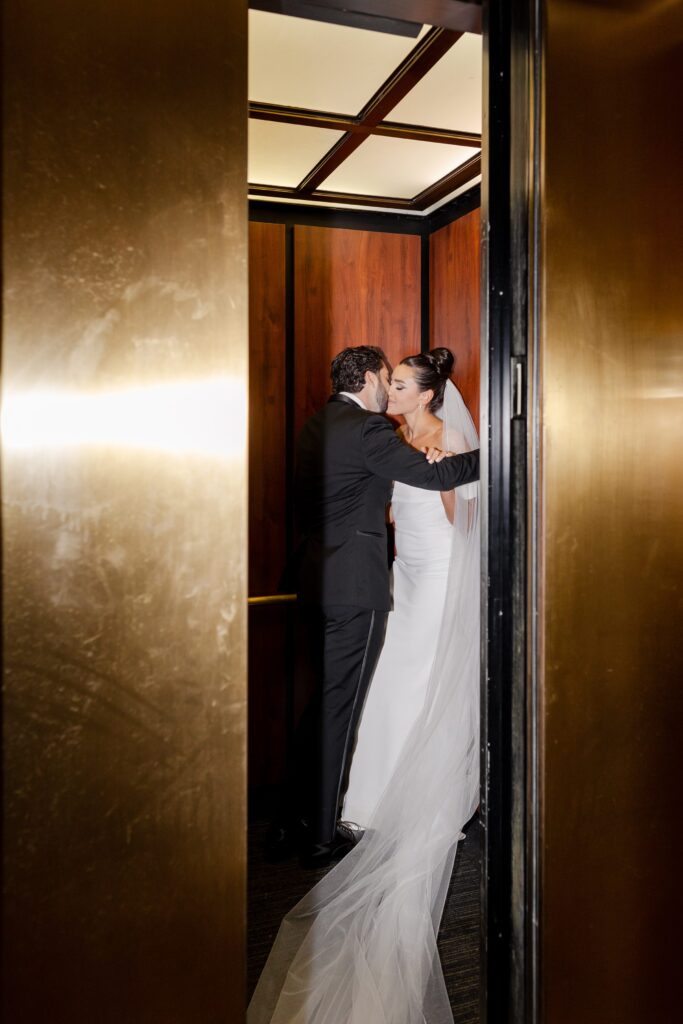 bride and groom elevator kiss, modern black-and-white wedding, Down Town Club at Cescaphe
