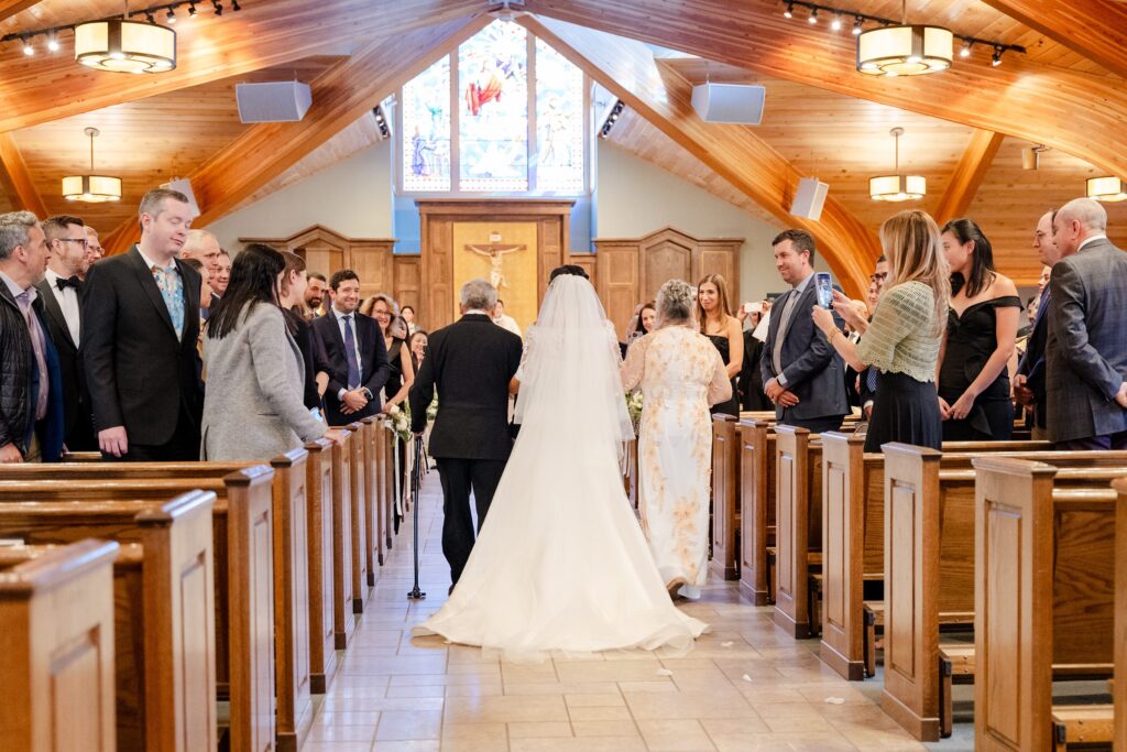 Our Lady of the Mountains Catholic Church in Jackson Hole, Wyoming, Bride walking down the aisle
