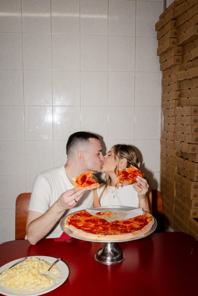 Kissing at pizzeria, engagement session at pizzeria, A&V Pizzeria New York