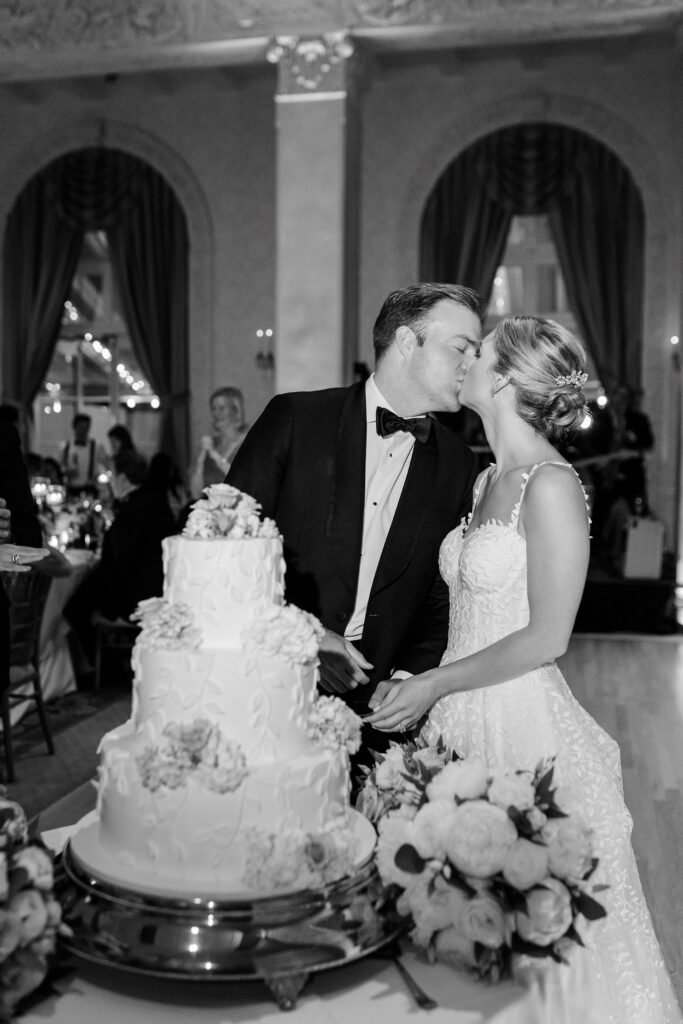 bride and groom cutting cake at Westchester Country Club, posing can look natural