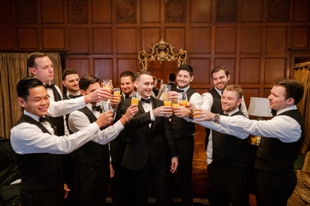 Cipriani 42nd St wedding, groomsmen cheering, groomsmen getting ready