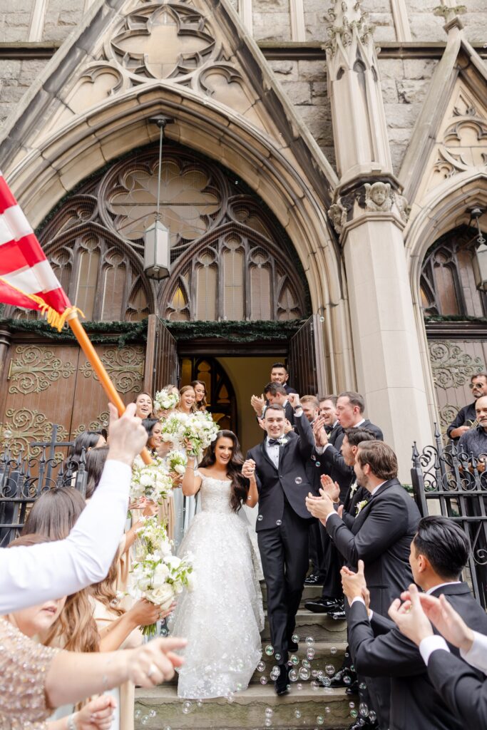 grand exit at St. Cyril & Methodius Croatian Catholic Church, Croatian wedding, New York City grand exit, bridal party celebrates newlyweds