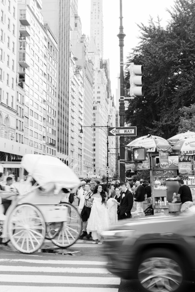 bride and groom crossing the busy street in New York City