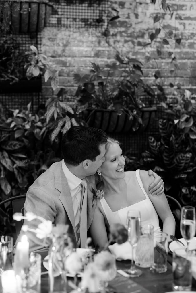 Bride and groom during speeches, intimate wedding at Brooklyn Winery
