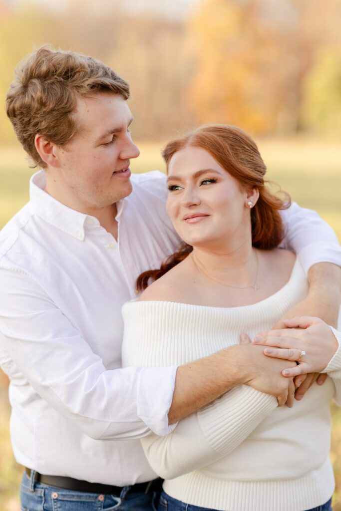 engagement session in New York, couple holding each other in engagement session, posing for an engagement session,