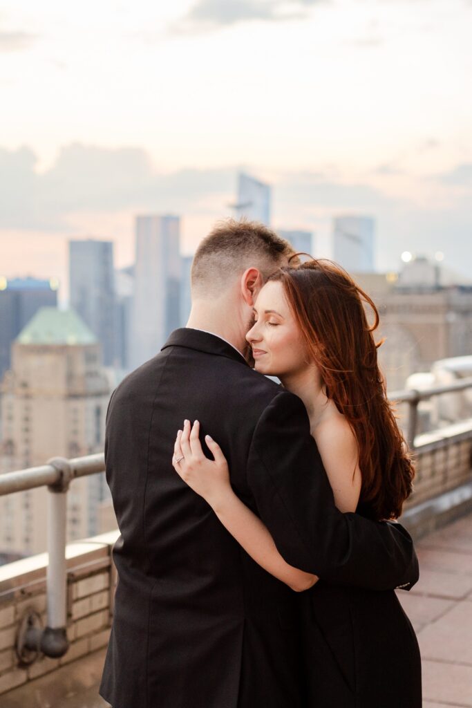 engagement session in New York, couple hugging on balcony of the Chrysler Building in NYC, New York City engagement session, Chrysler building 