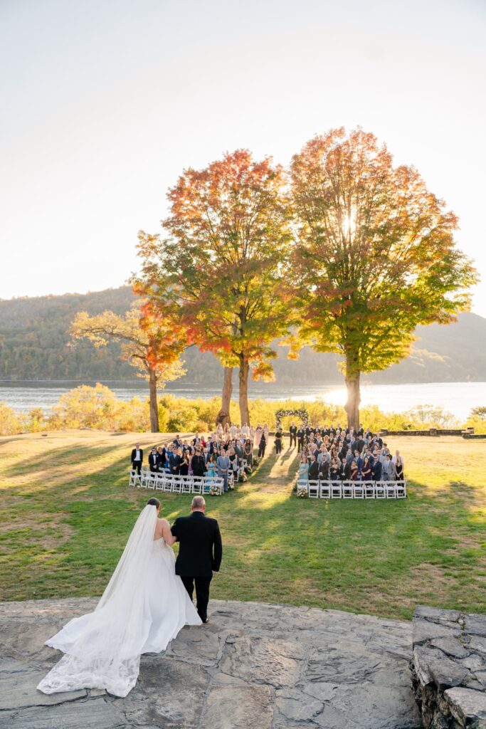 bride being escorted by father down the aisle