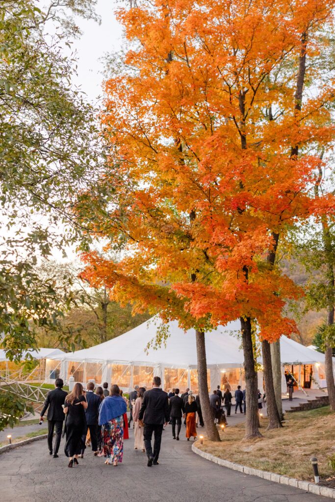 guests walking to tent from the ceremony to reception