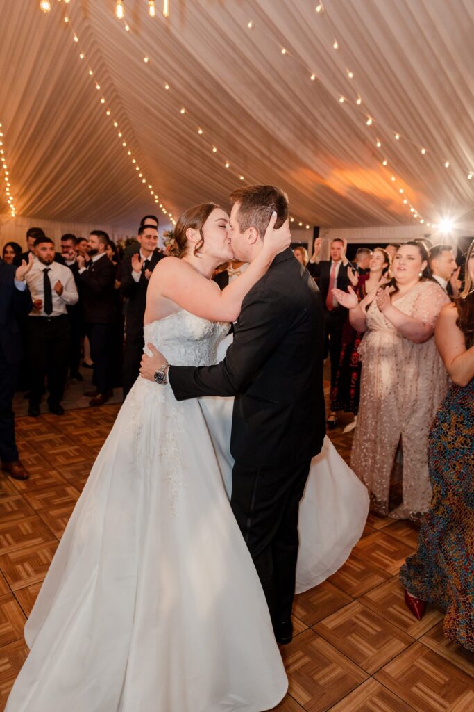 bride and groom kissing on the dancefloor