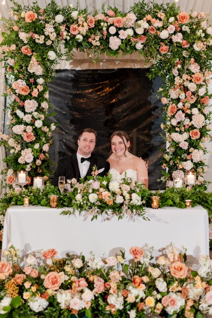 bride and groom at the sweetheart table