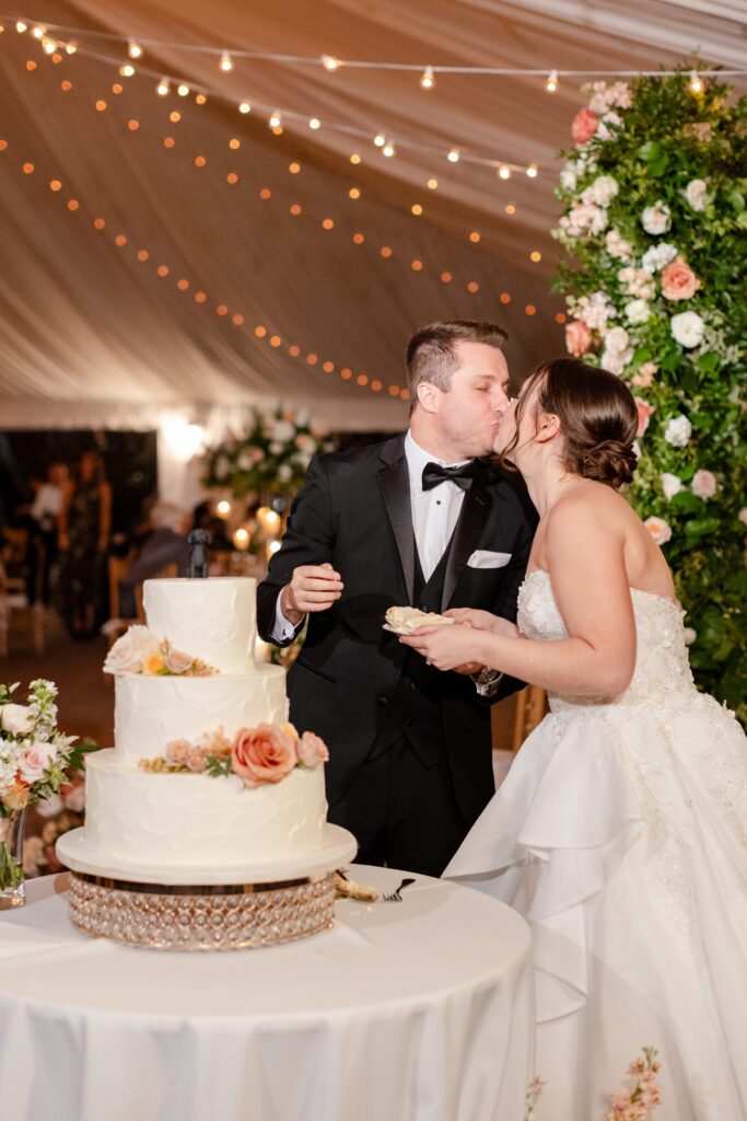 bride and groom cutting the cake 