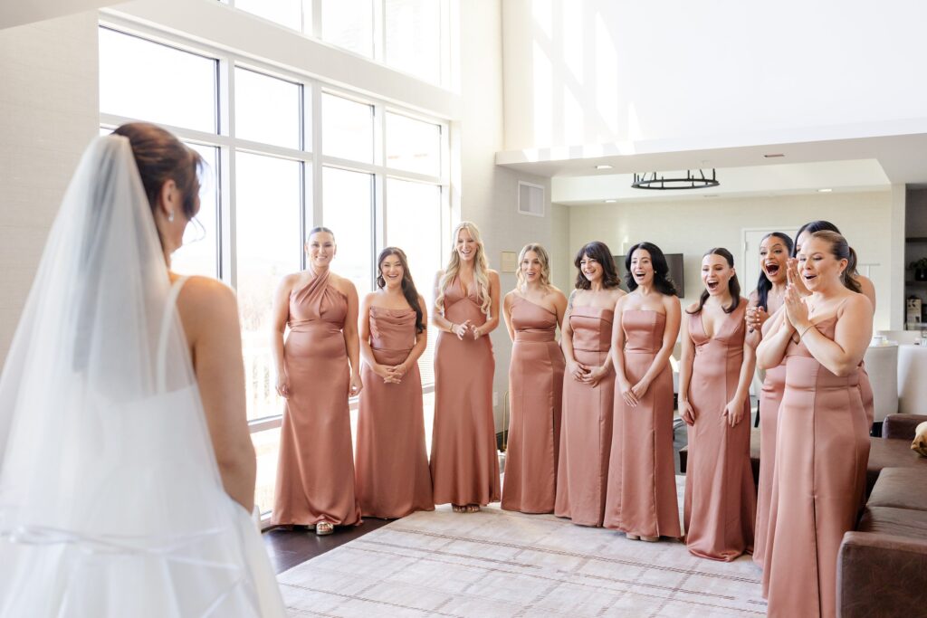 first look with bride and bridesmaids at Red Maple Vineyard venue in West Park, NY