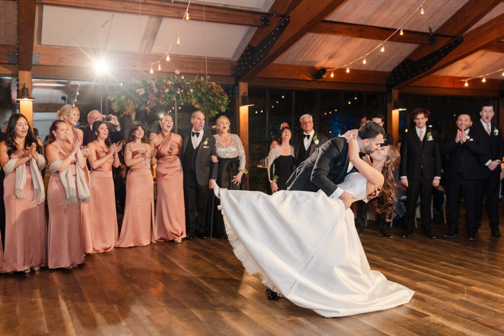 New York Vineyard Wedding Inspiration, bride and groom first dance, bride and groom kissing during first dance at  red Maple Vineyards, 