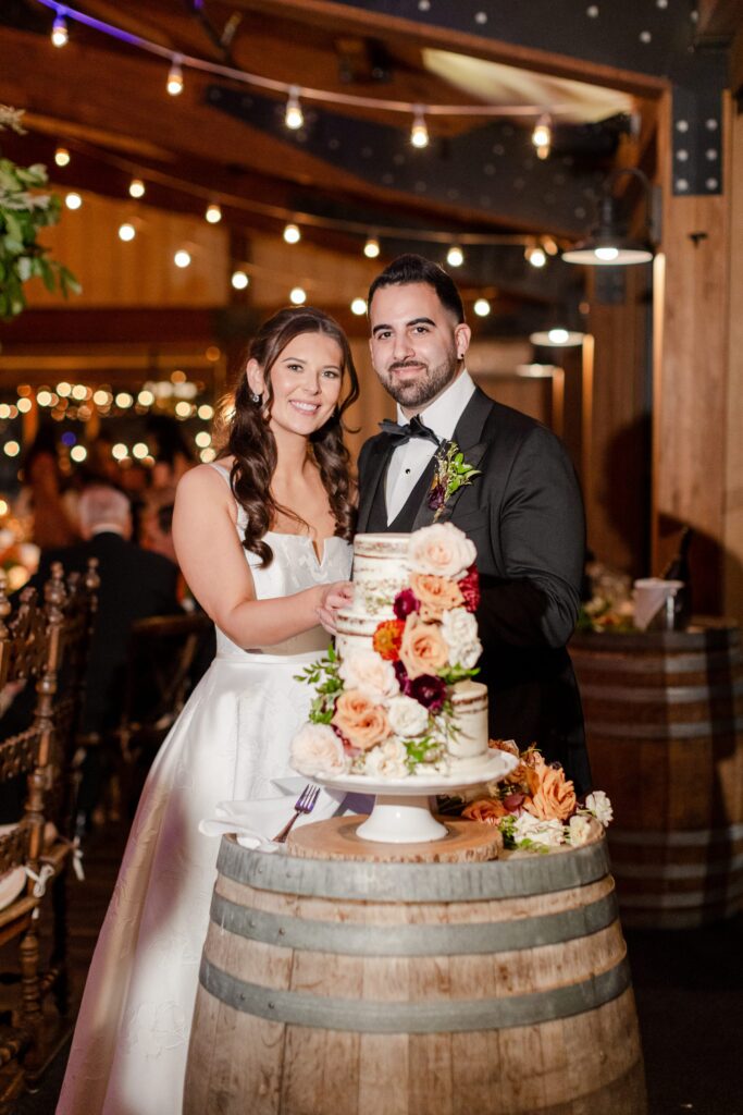 New York Vineyard Wedding Inspiration, bride and groom rustic cake, silent cake cutting at Red Maple Vineyards