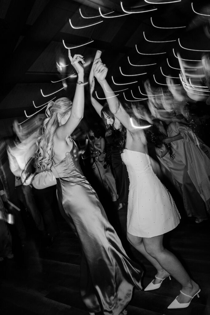 bride and guests dancing during fall wedding reception at Red Maple Vineyards in West Park, New York