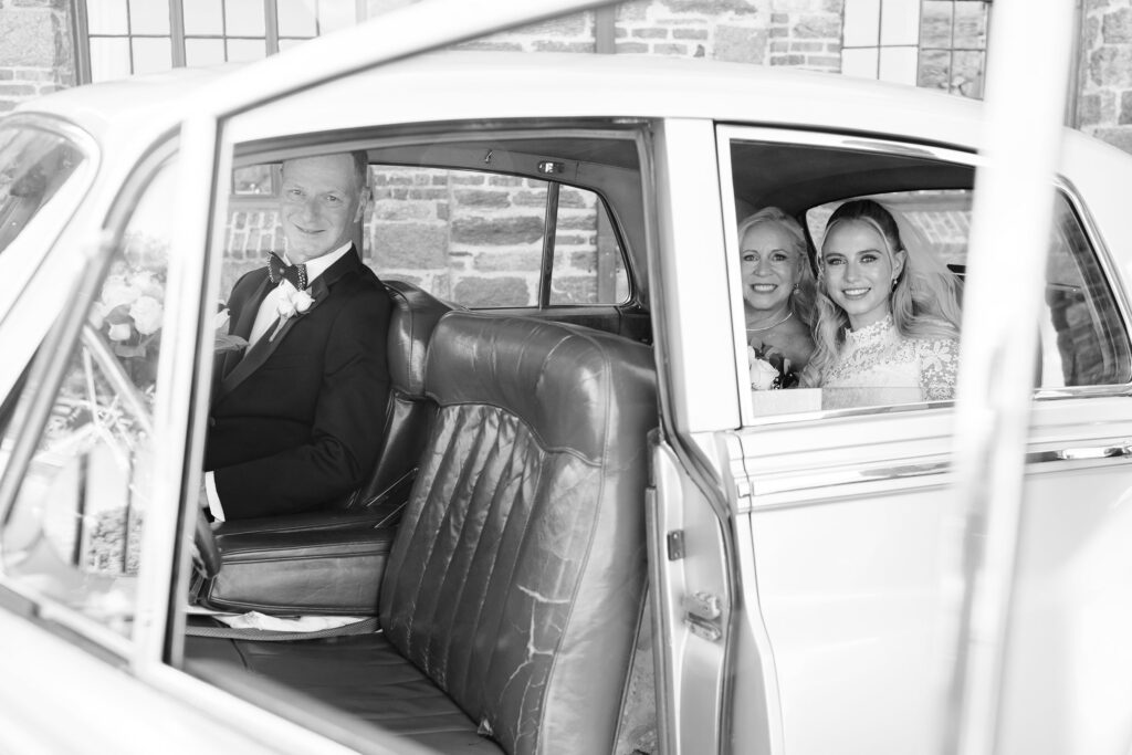 bride and parents of bride in Rolls Royce heading to ceremony, Wedding at Winged Foot Golf Club