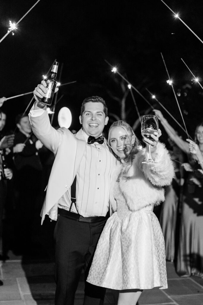 bride and groom cheers under sparklers at Winged Foot Golf Club, Winged Foot Golf Club Wedding