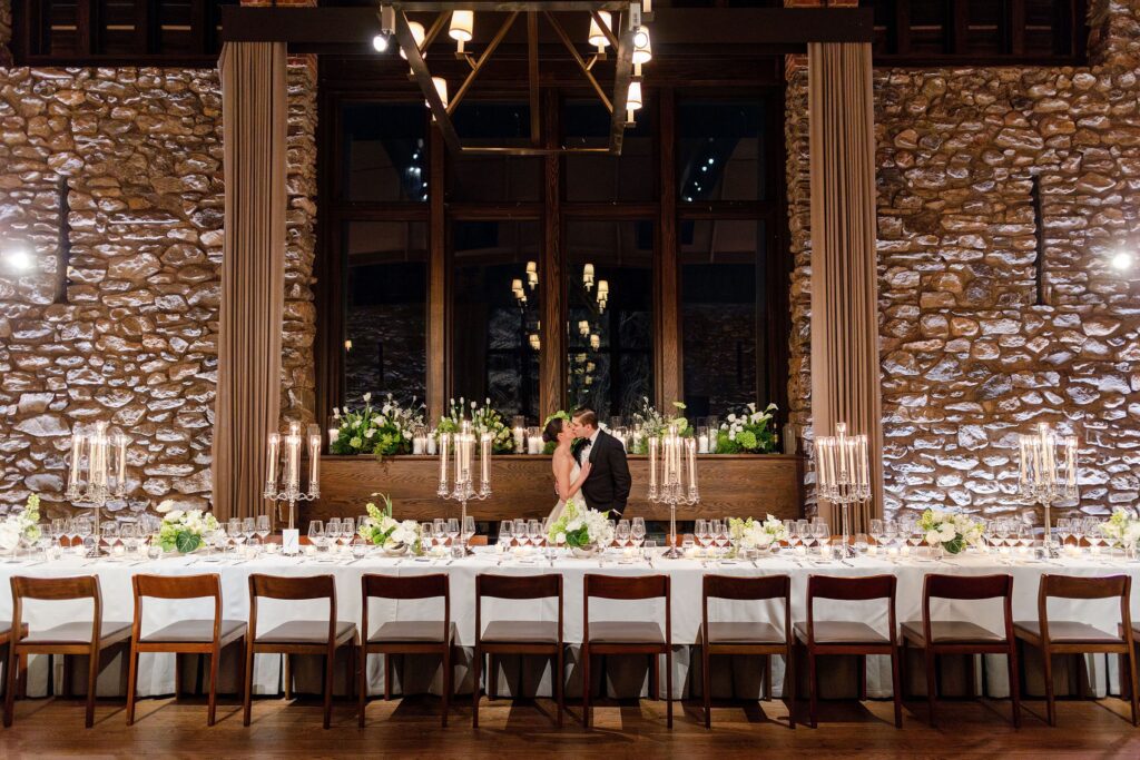 bride and groom kissing during wedding reception reveal in Upper Hayloft at Blue Hill at Stone Barn