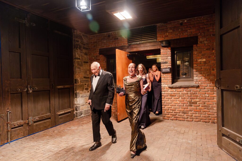 cocktail hour at Hay Barn, guest walking into cocktail hour Blue Hill at Stone Barn