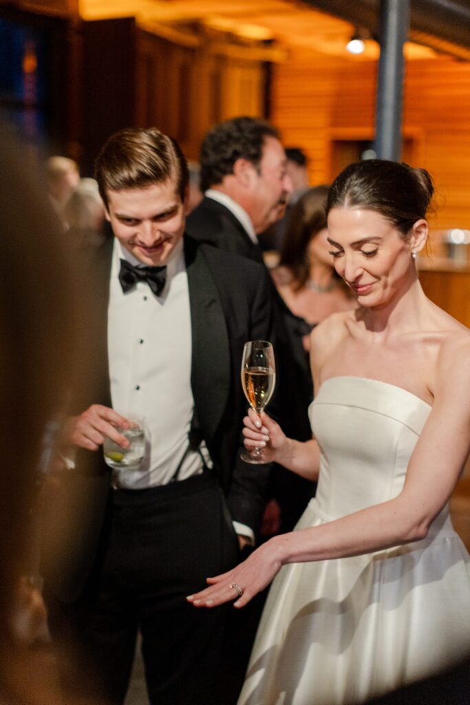 bride and groom dancing and singing on during the reception