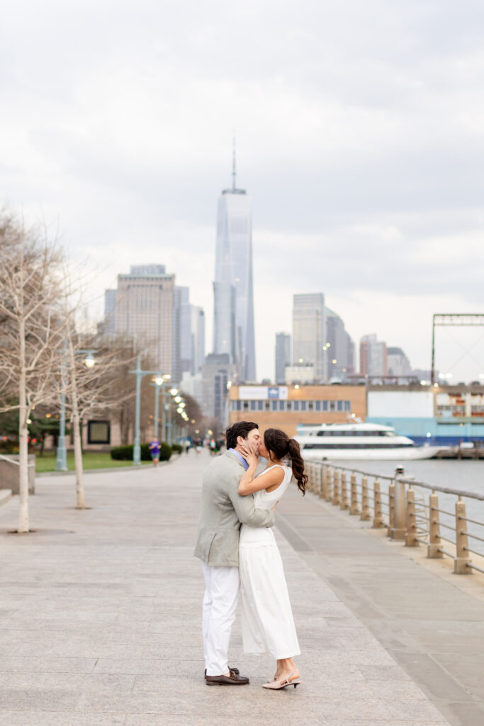 couple kissing by the water engagement session at West Village, top West Village engagement locations