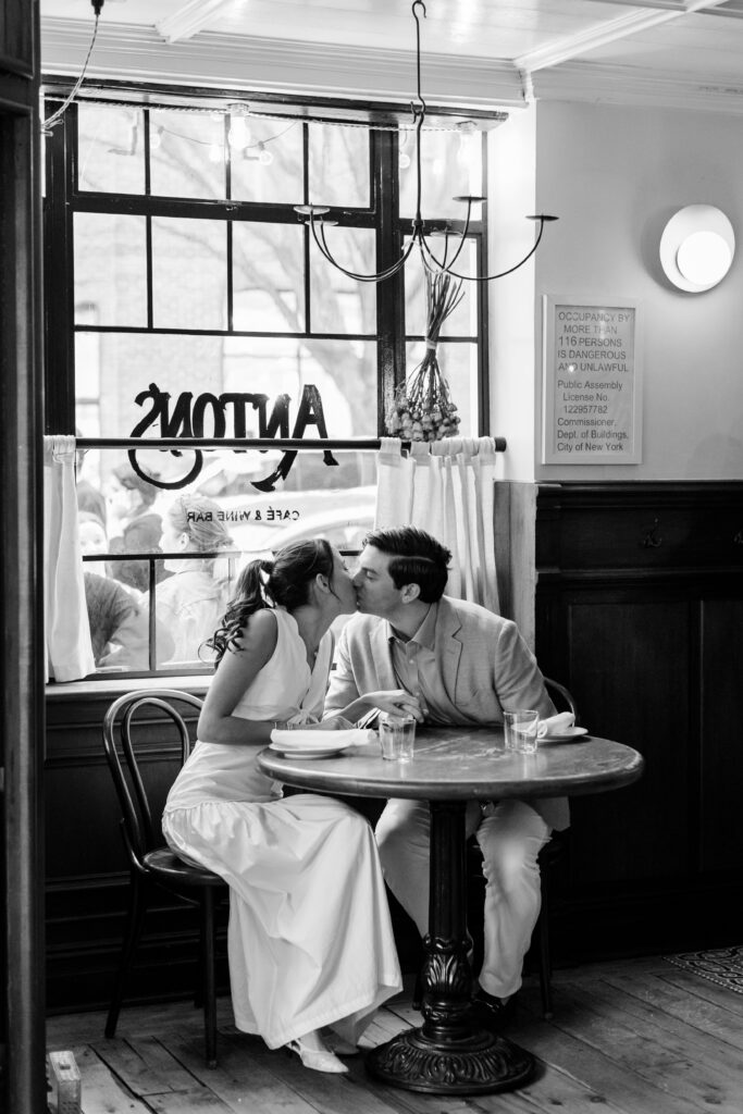 couple kissing during engagement photos at Anton's