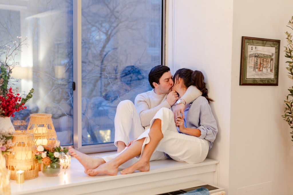 couple kissing at home during engagement photos in West Village