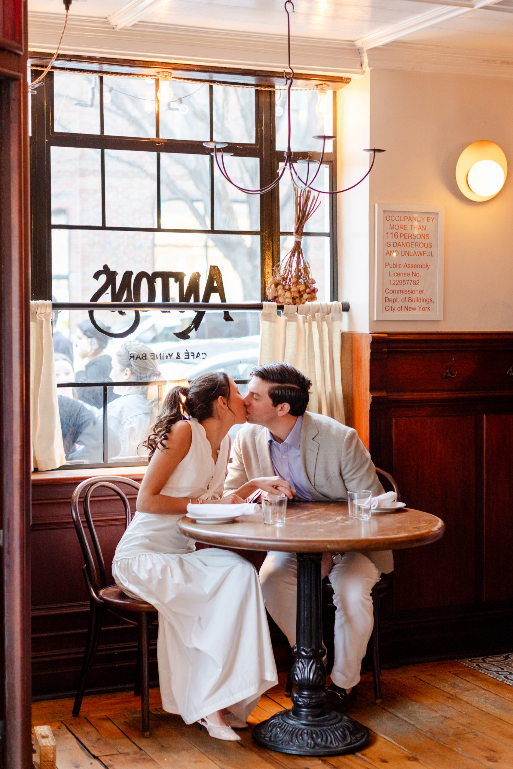 Couple kissing in Anton's in New York