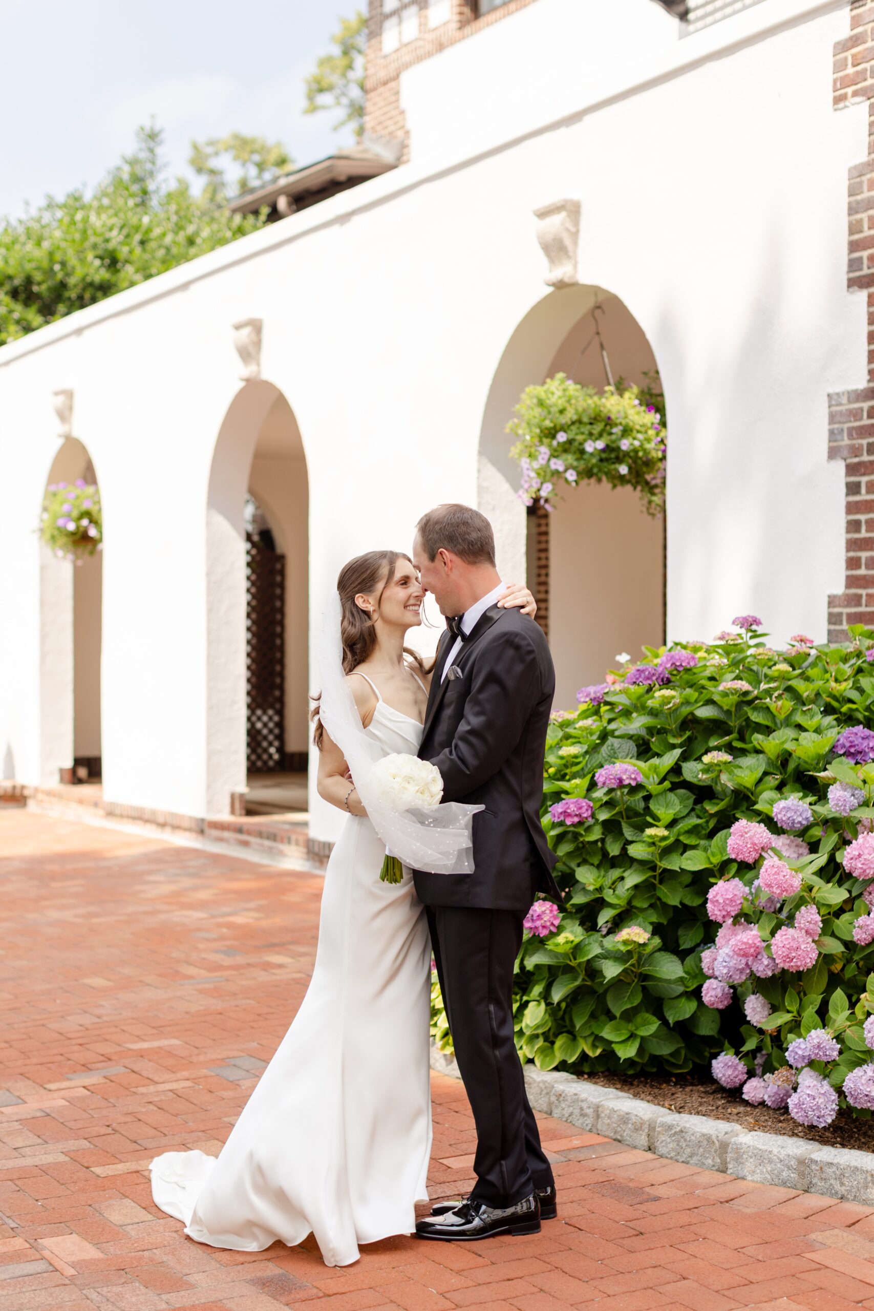 Bride and groom portraits during their summer outdoor wedding Wedding at Westchester Country Club