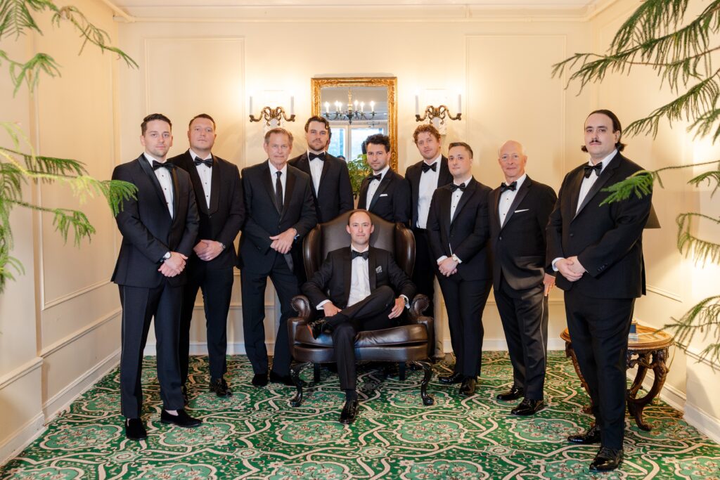 groom and groomsmen posing in Westchester Country Club