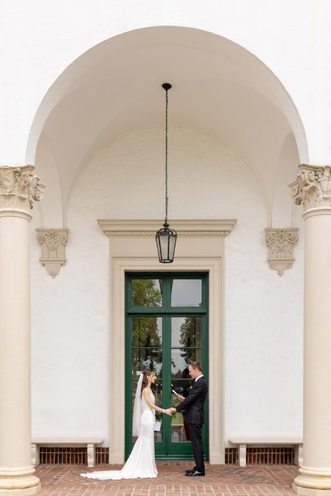 bride and groom exchanging private vows