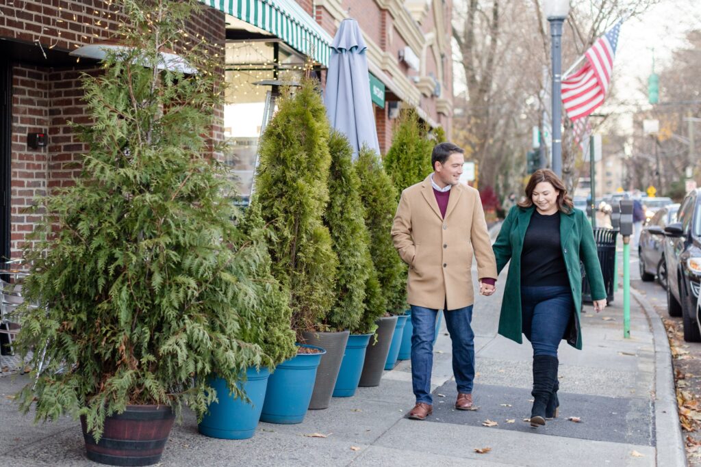 couple walking in the the streets of NYC during winter engagement session