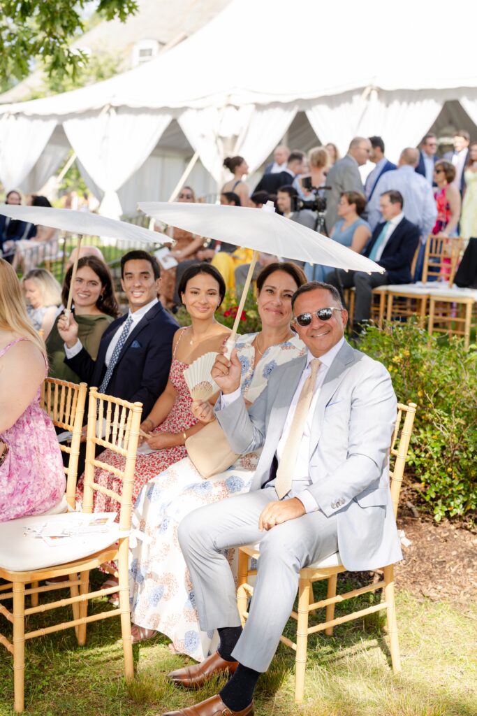 second wedding photographer example of how to capture guest during the wedding ceremony, guest smiling waiting fro the bride to walk down